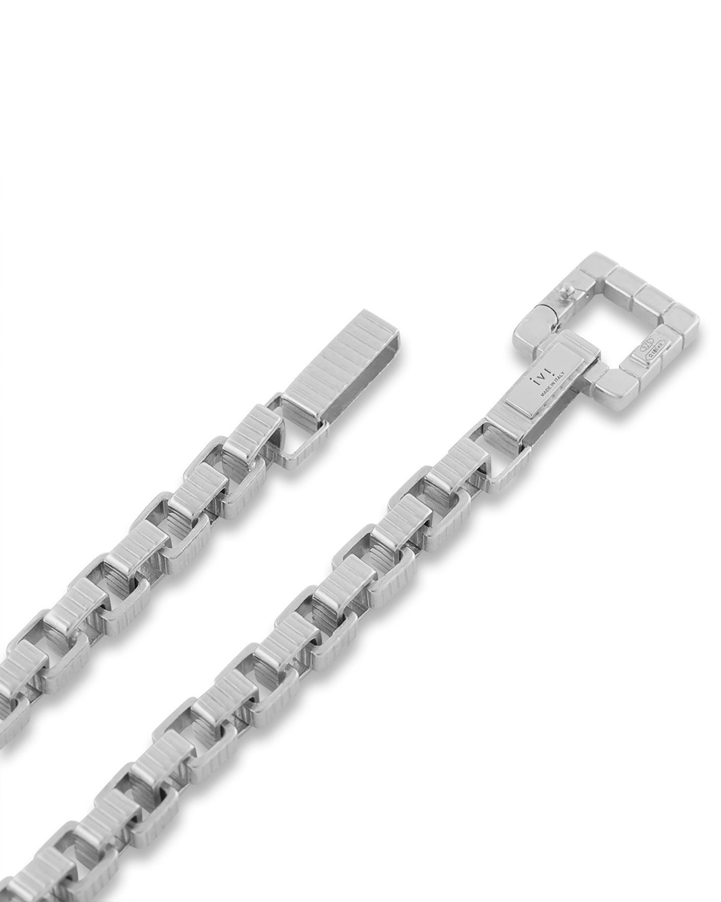 A close up of a rhodium-plated chain princess necklace with a square clasp, laid out on a white background.