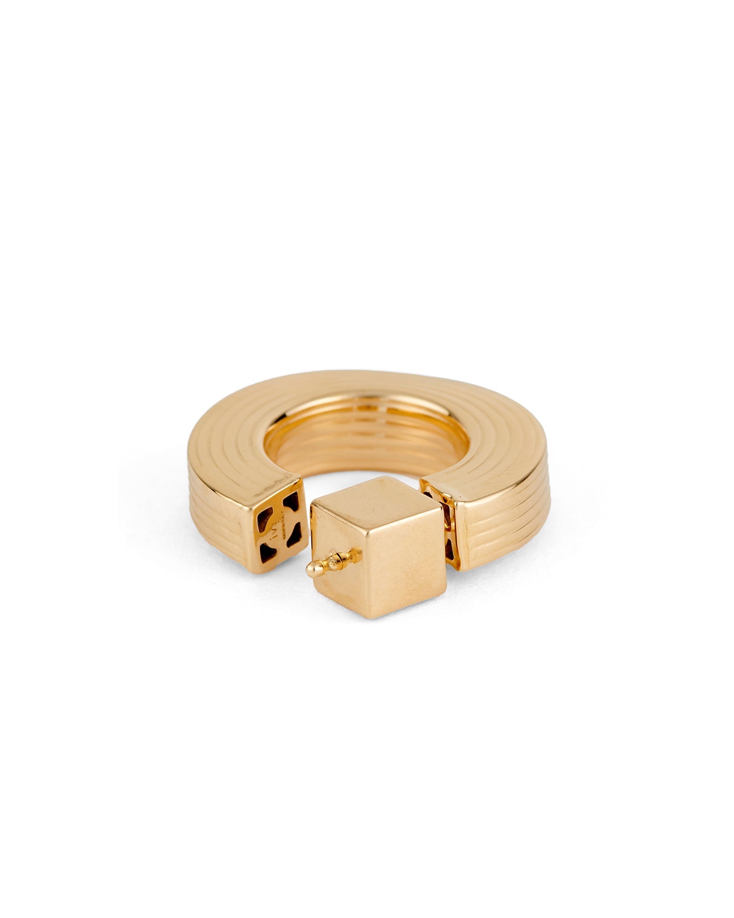 A gold-plated hollow hoop earring with a square post.