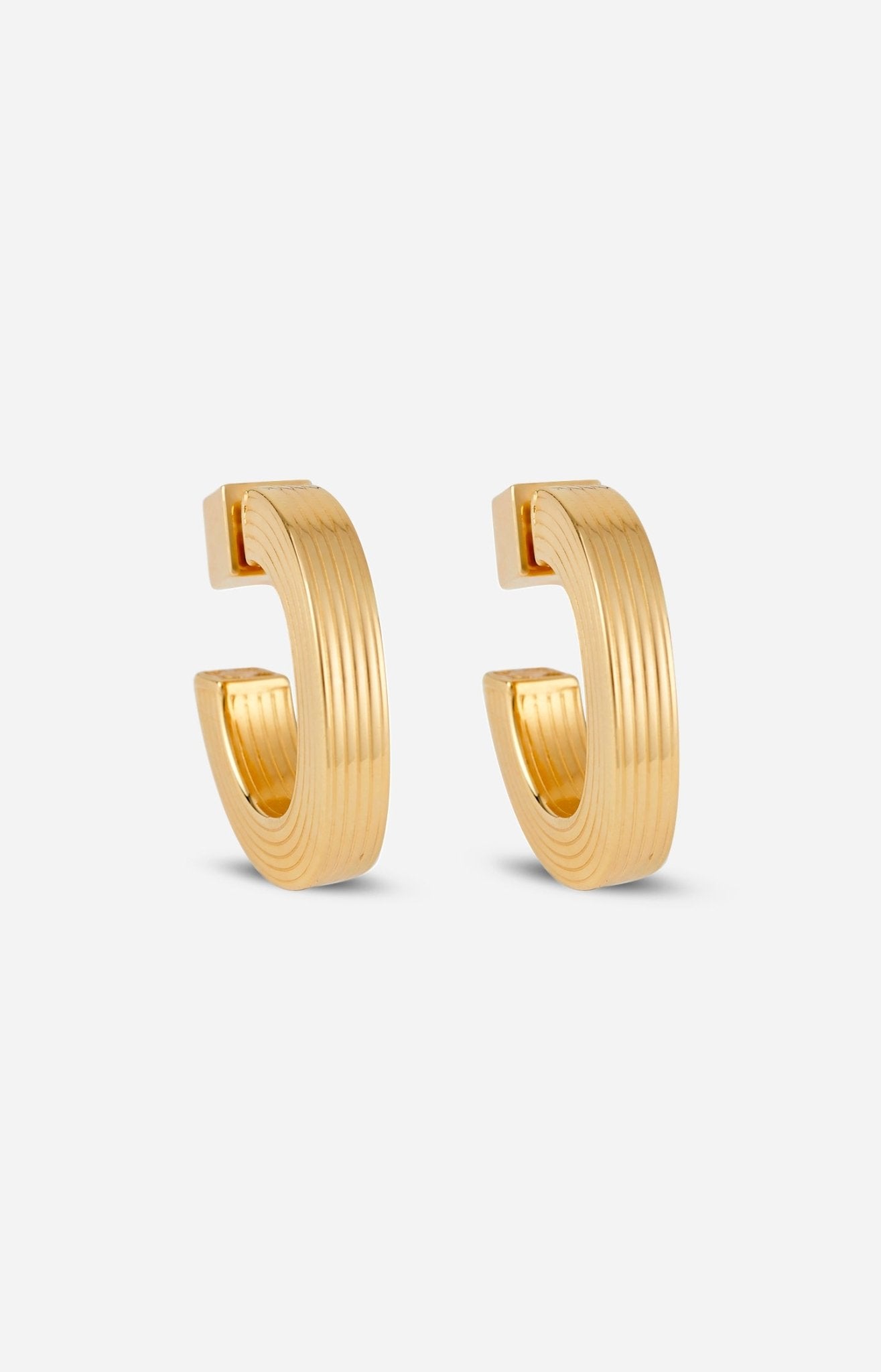 A pair of gold-plated hoop earrings with a square post, displayed against a white background.