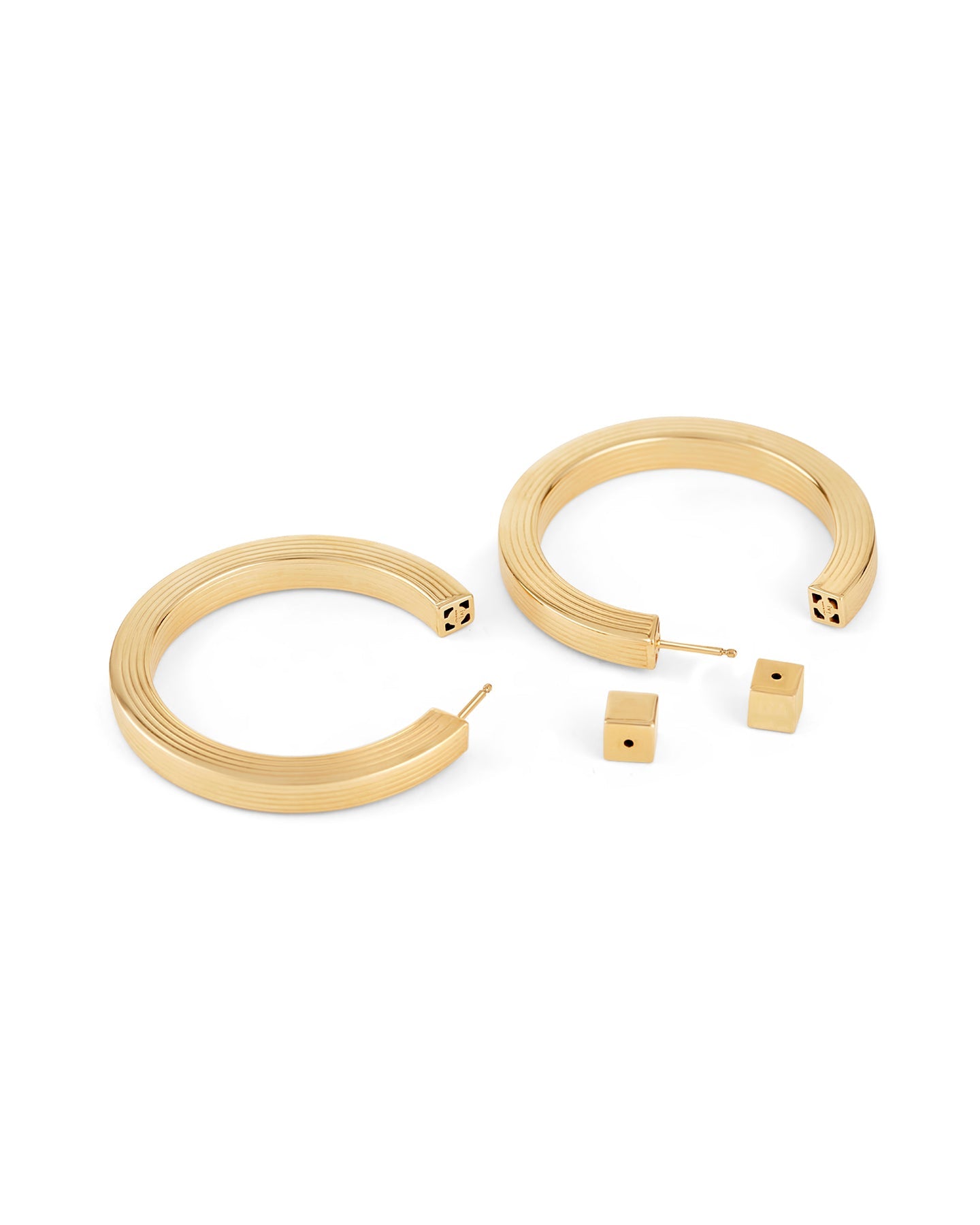 A pair of gold-plated hoop earrings with a square post, displayed against a white background.