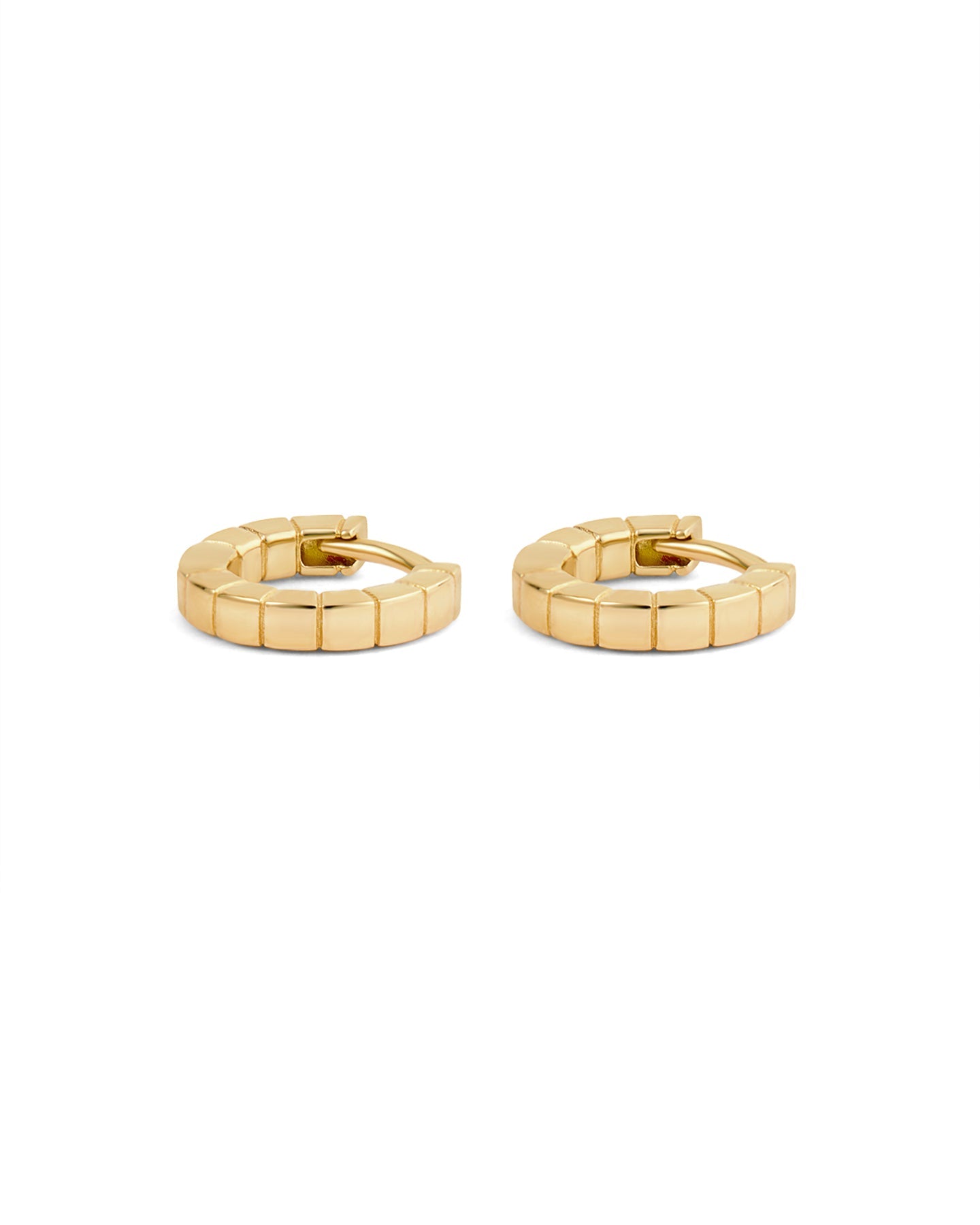 A pair of mini gold-plated Signore huggies with a textured design, resembling a curving row of square beads.