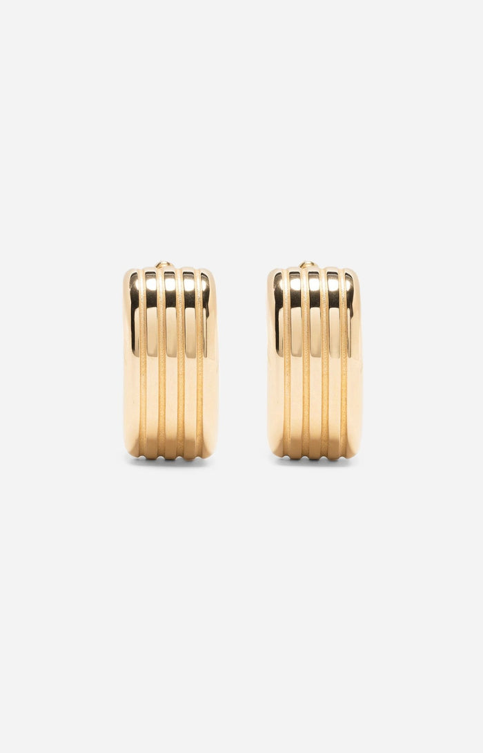 A pair of gold-plated oval hoop earrings on a white background.