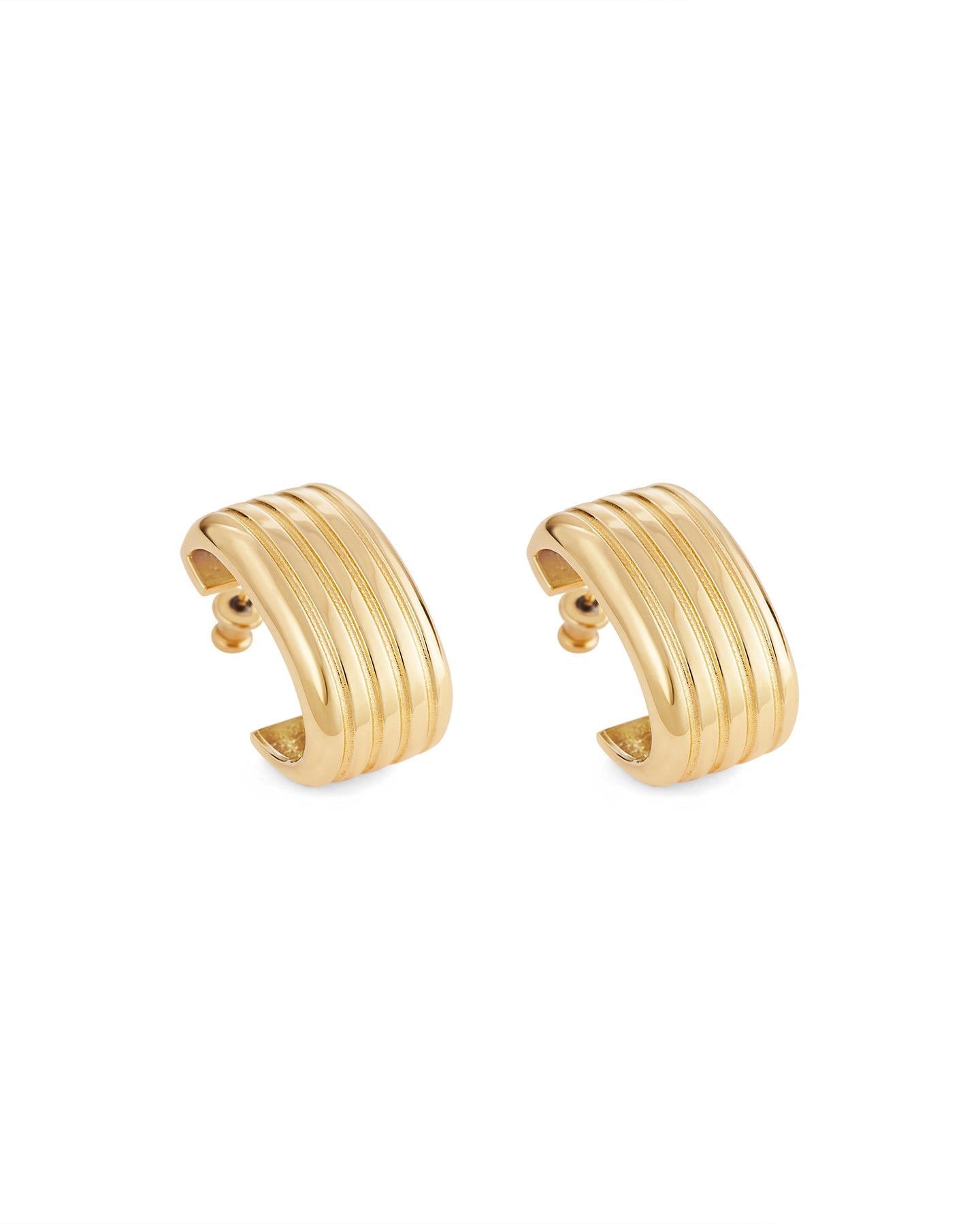 A pair of gold-plated oval hoop earrings on a white background.