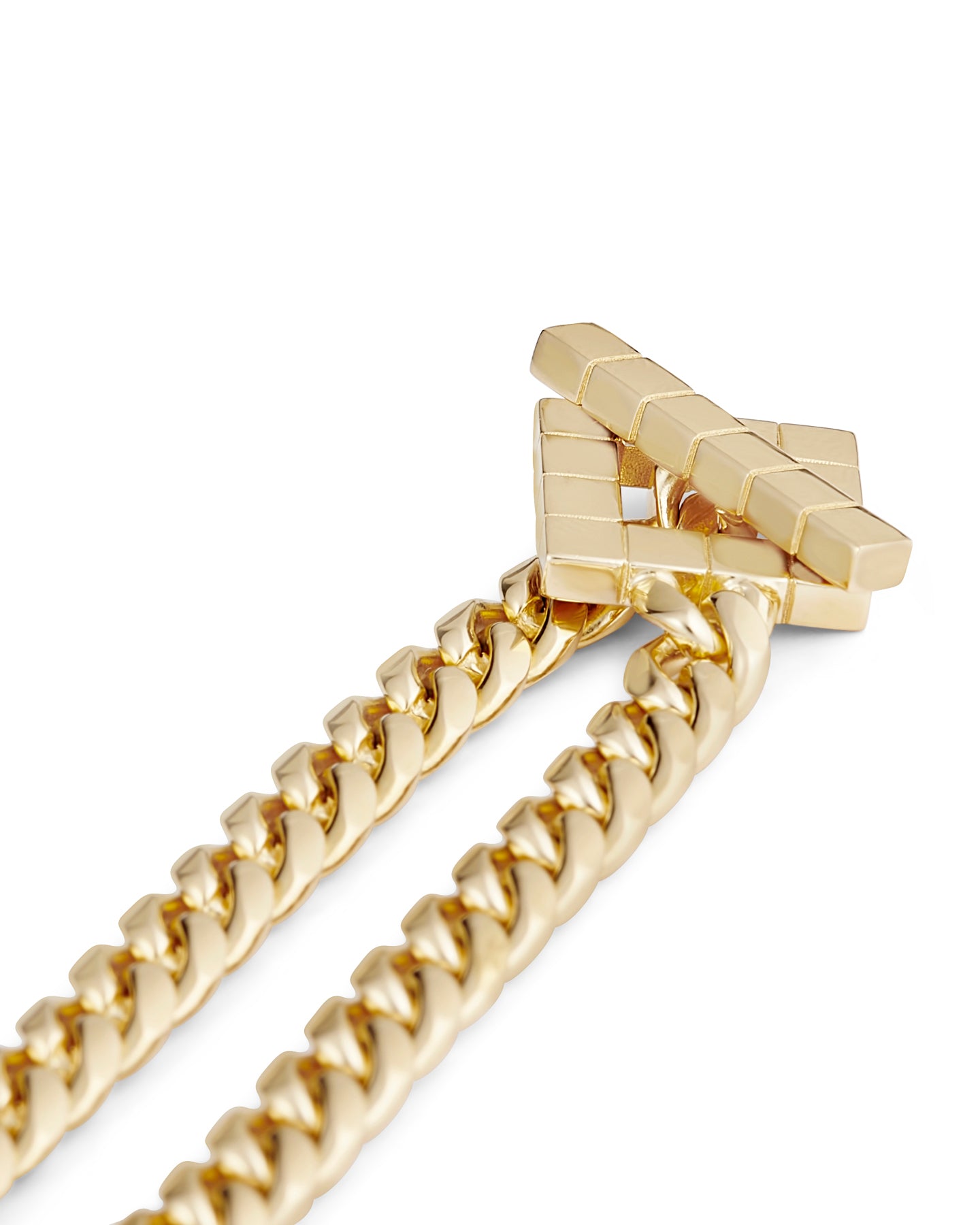 A close up of a gold-plated chunky chain necklace with a sculptural geometric clasp on a white background.