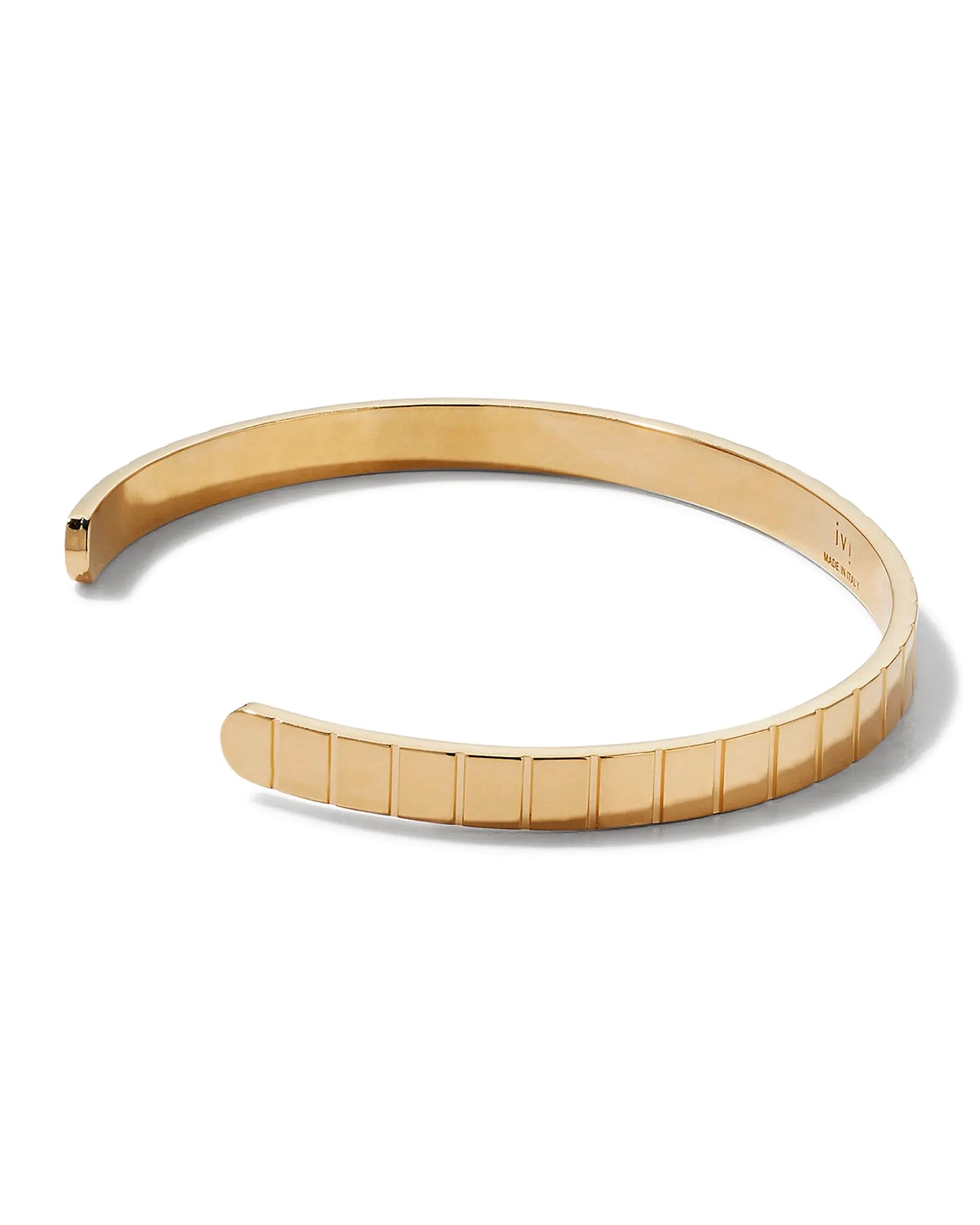 A gold-plated single slot cuff bracelet with a grooved profile on a white background.