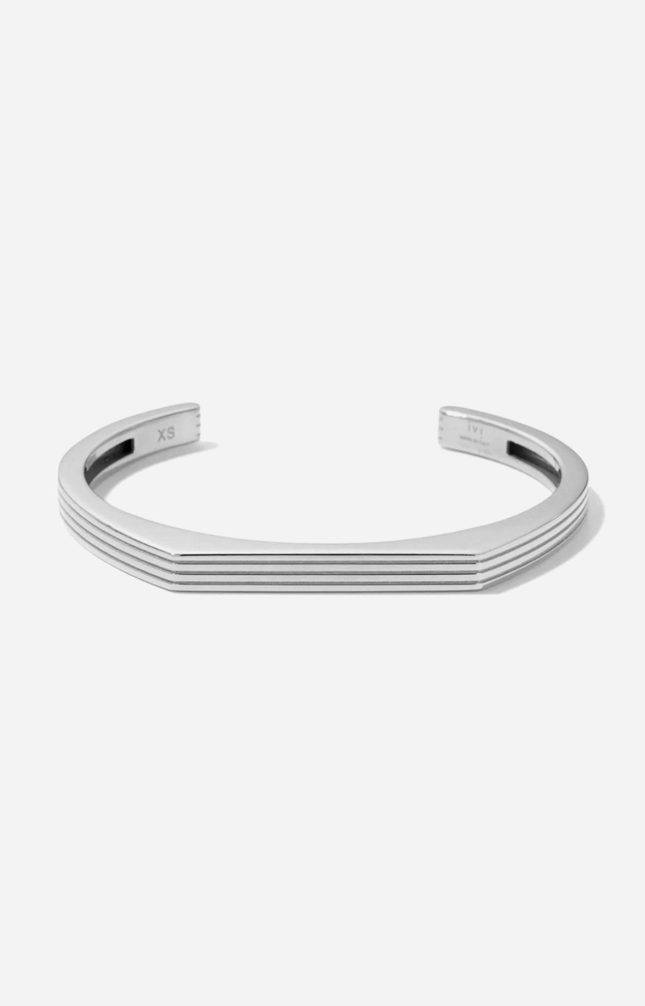 A rhodium-plated cuff bracelet with a sleek, modern design displayed on a white background. 