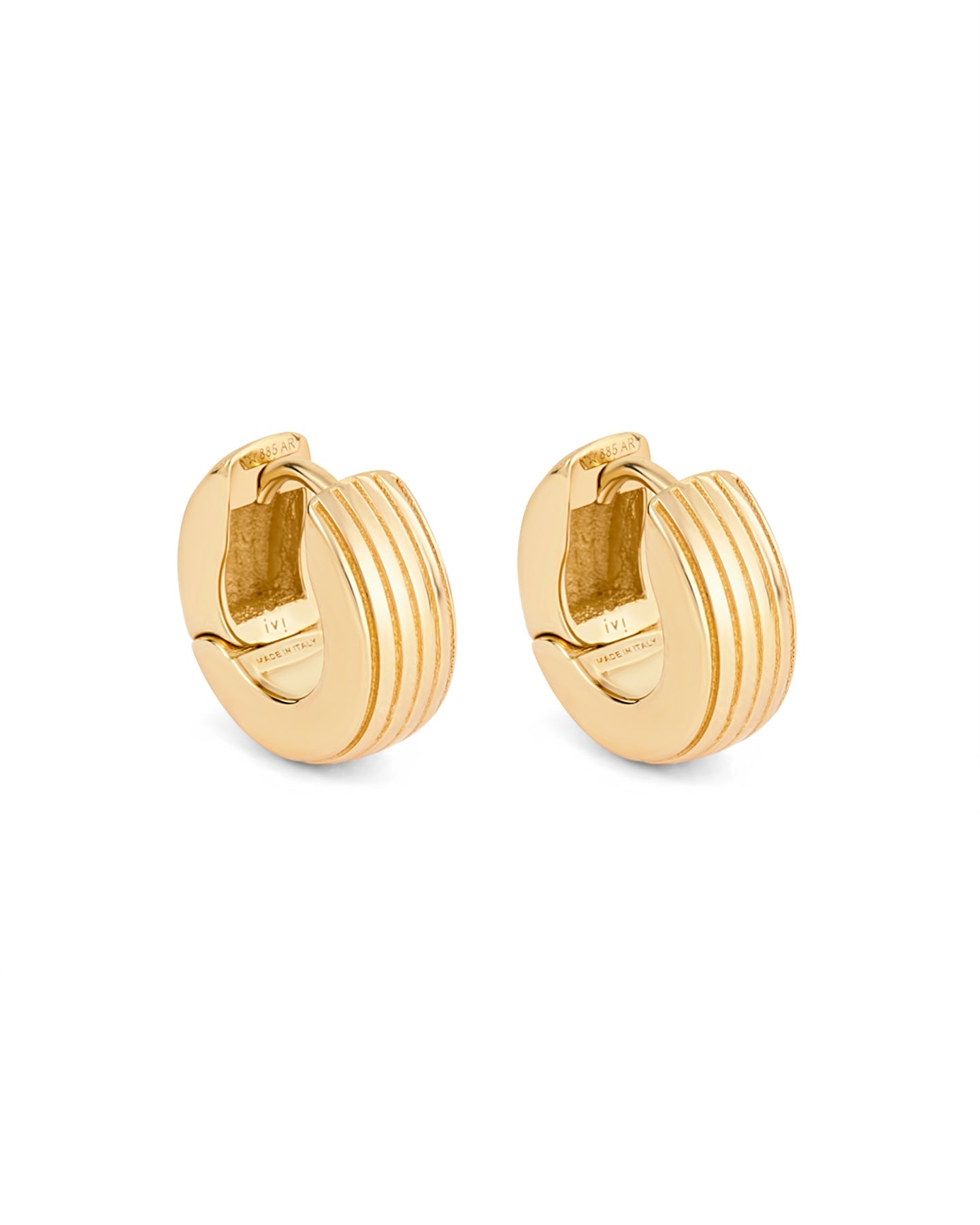 A pair of gold-plated round huggies earrings with a slim curved silhouette and engraved detailing on a white background.