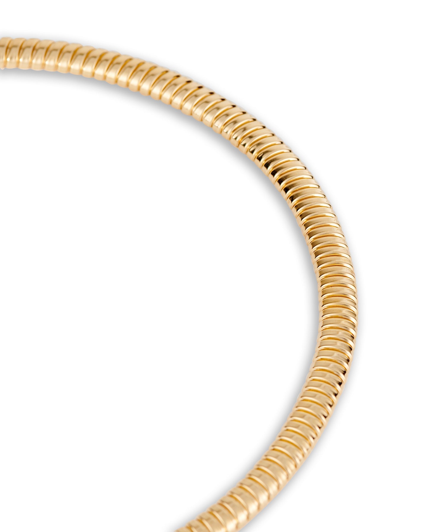 A close up of a gold-plated tubogas necklace on a white background.