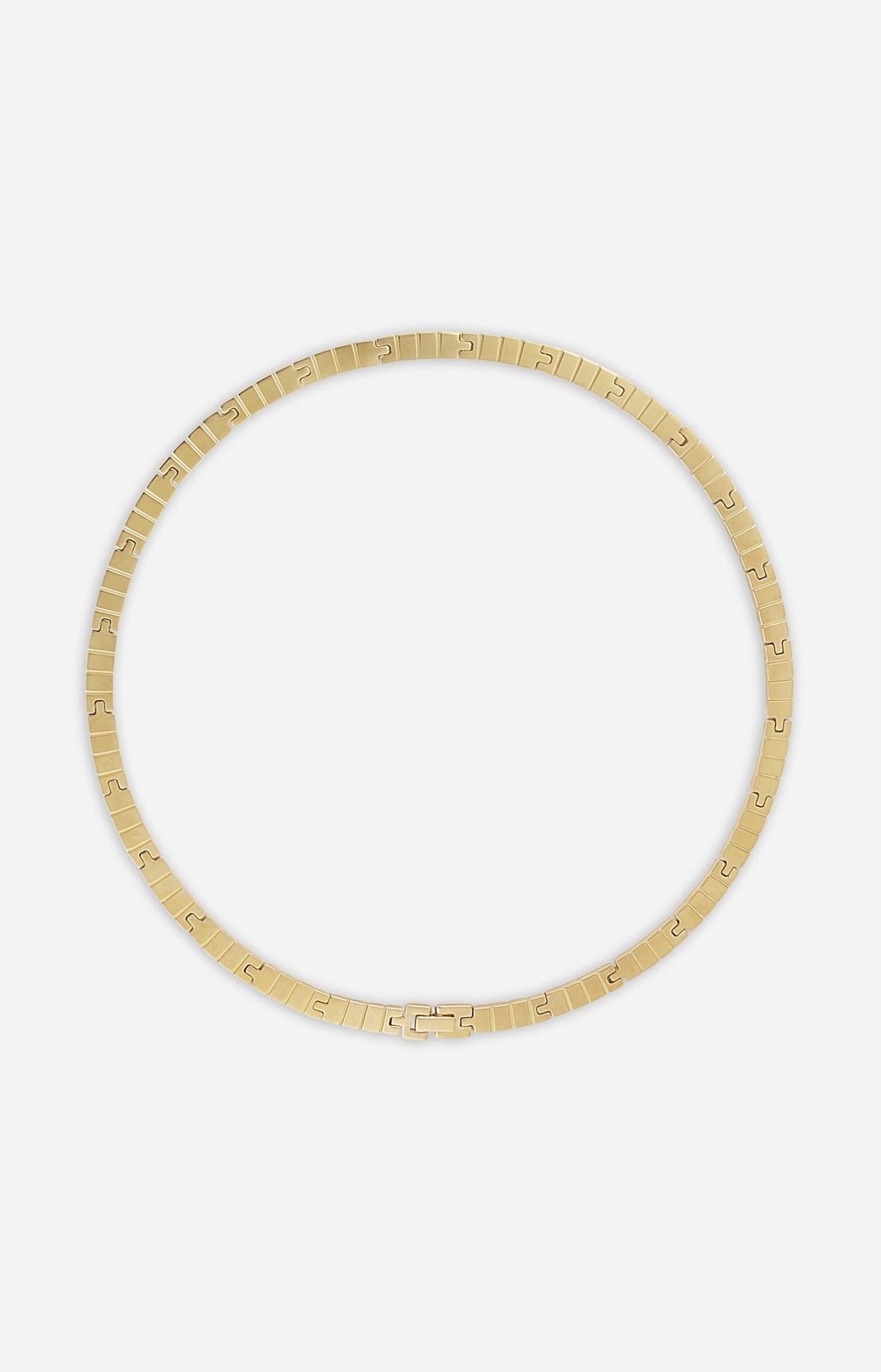 A gold-plated slim slot chain necklace on a white background
