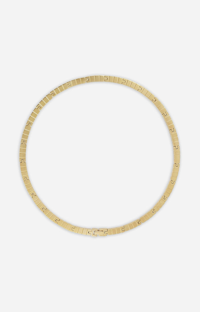 A gold-plated slim slot chain necklace on a white background