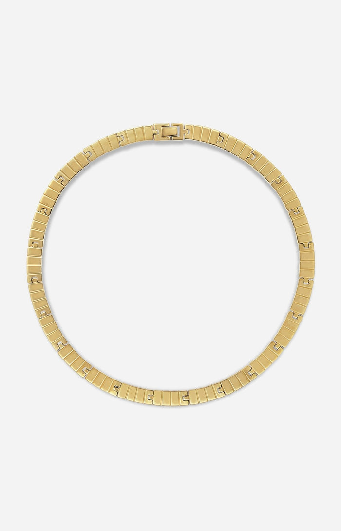 A gold-plated slot chain necklace on a white background
