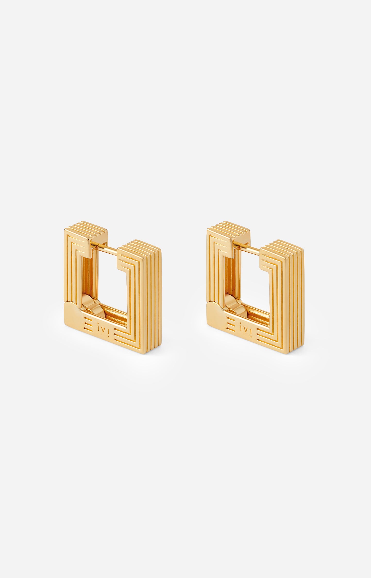 Pair of gold hoop earrings on a white background