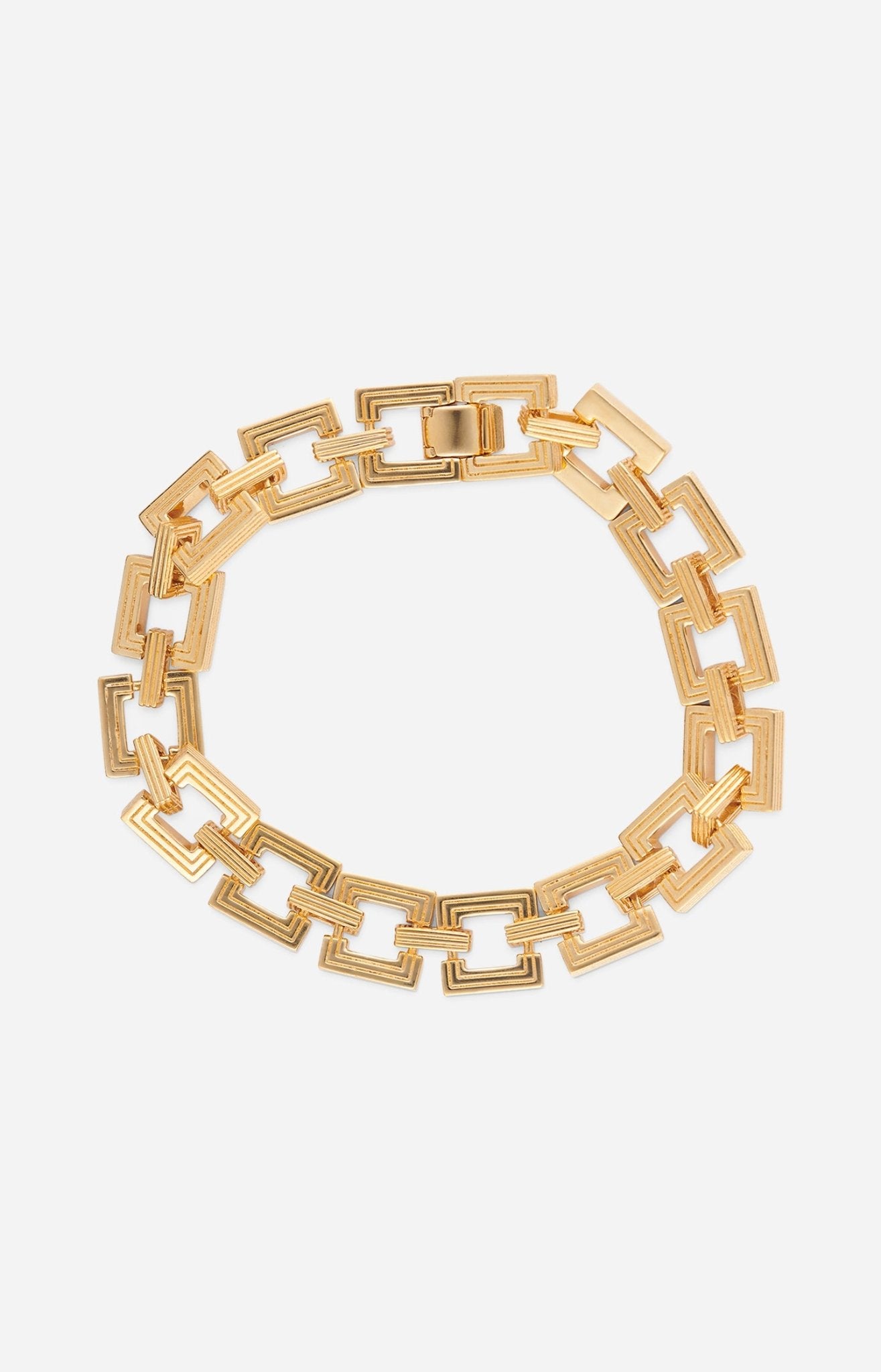 A gold-plated bracelet with interlocking square links, displayed against a white background.