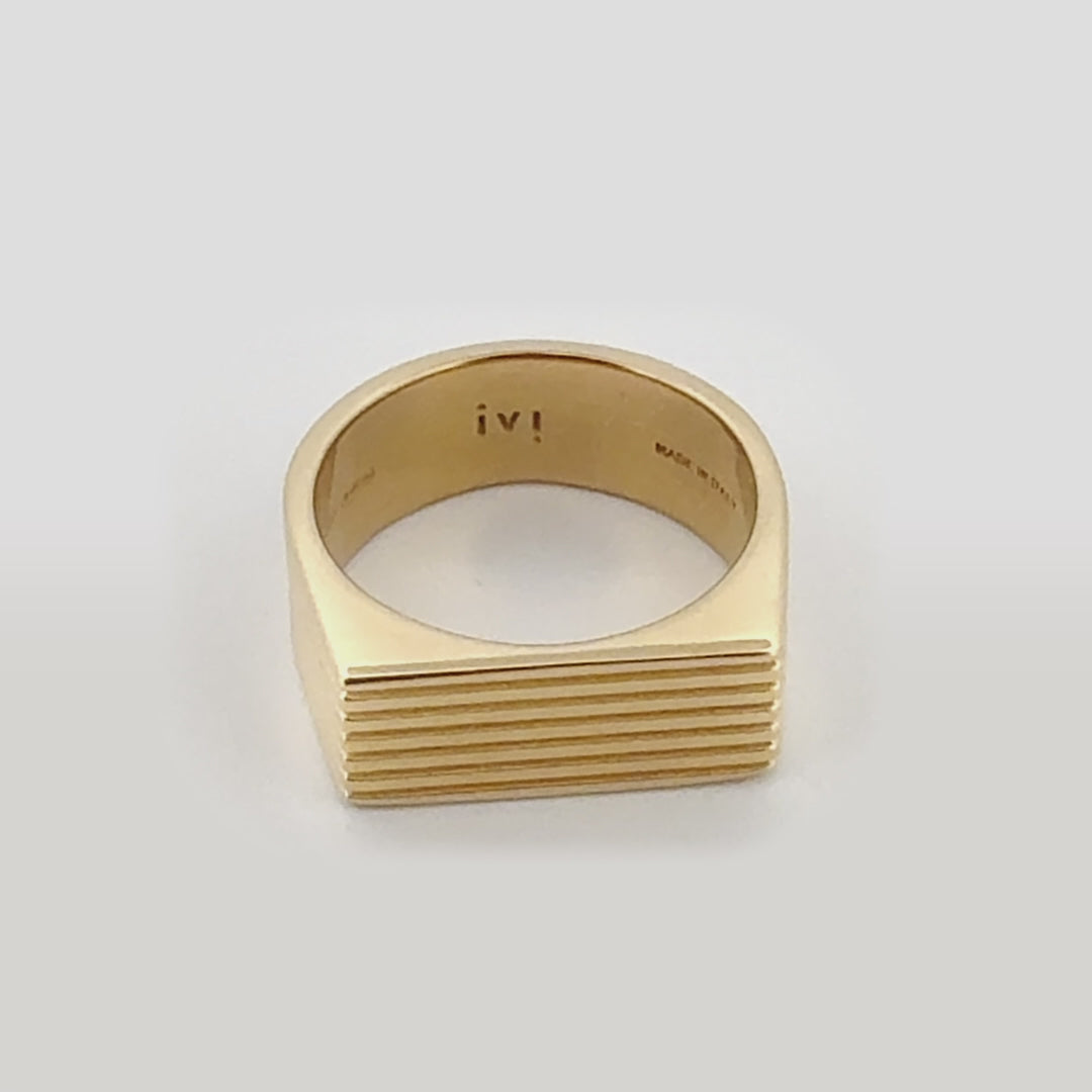 A video of a gold-plated signet ring with angular proportions