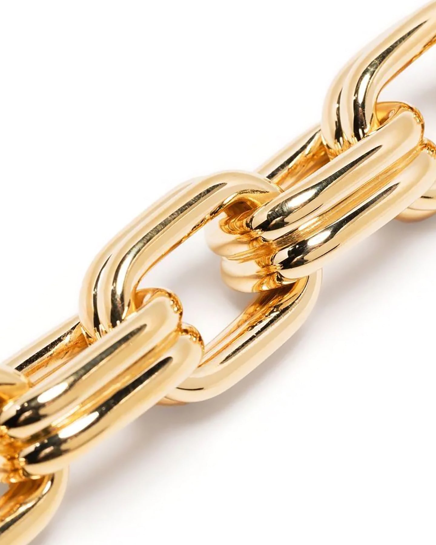 A close up of a gold-plated bracelet with oversized oval links, giving it a bold, chunky appearance.