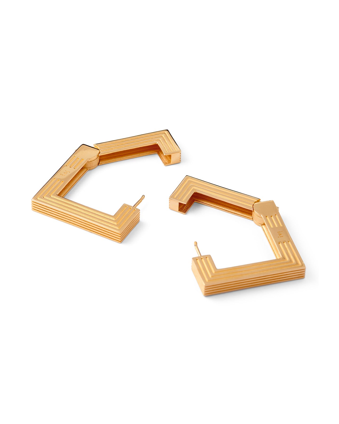 Large gold-plated sculptural hoop earrings on a white background.