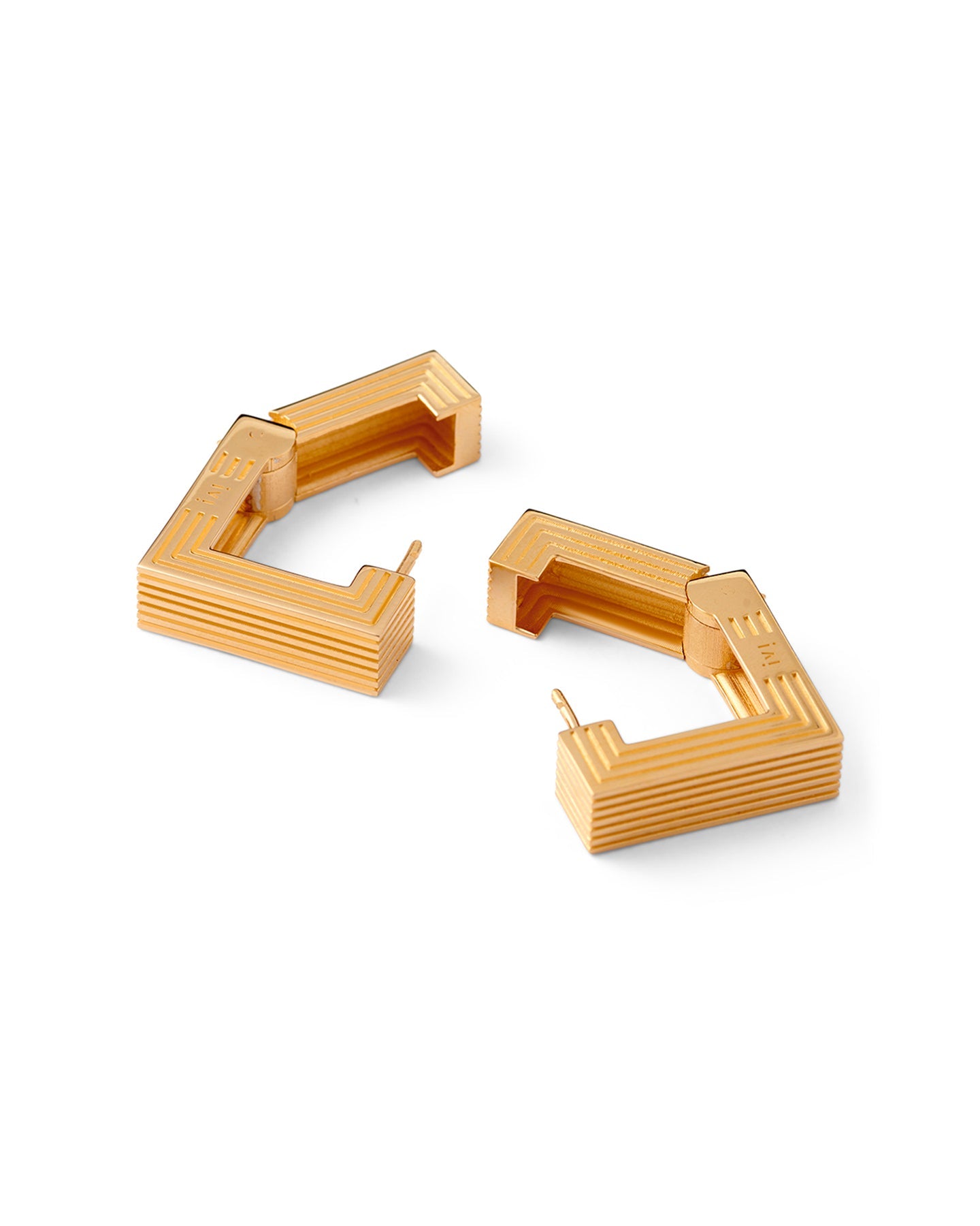 Pair of gold-plated medium Aurelia sculptural square hoop earrings on a white background.