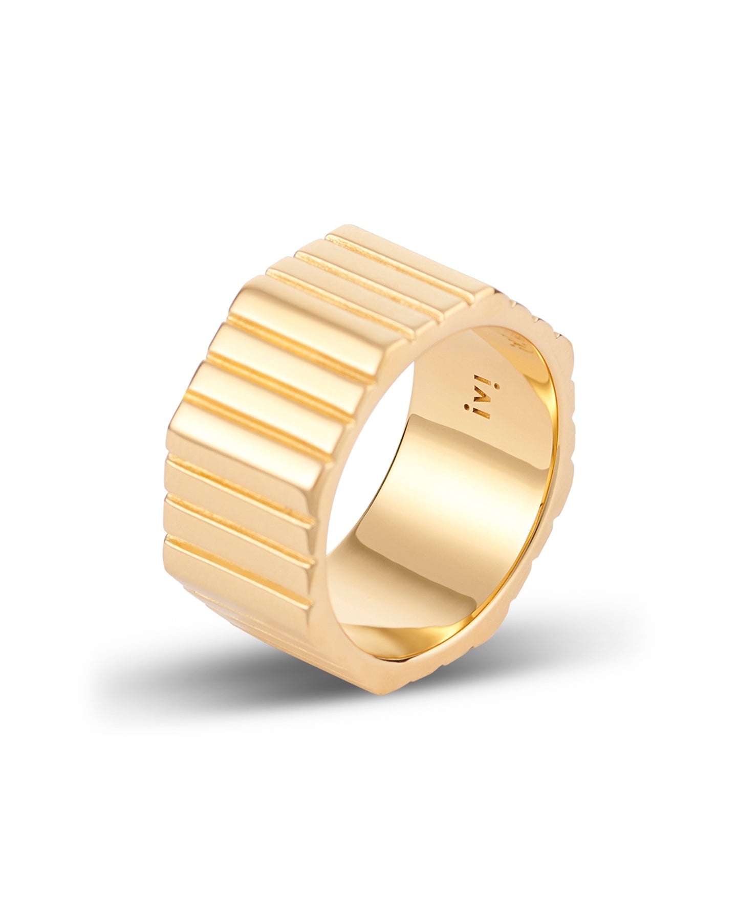 A gold-plated, octagonal-shaped ring with linear engravings on the band