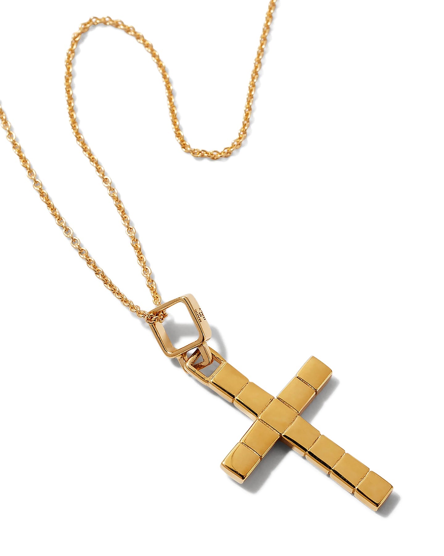 A gold-plated cross necklace with a custom chain against a white background. 