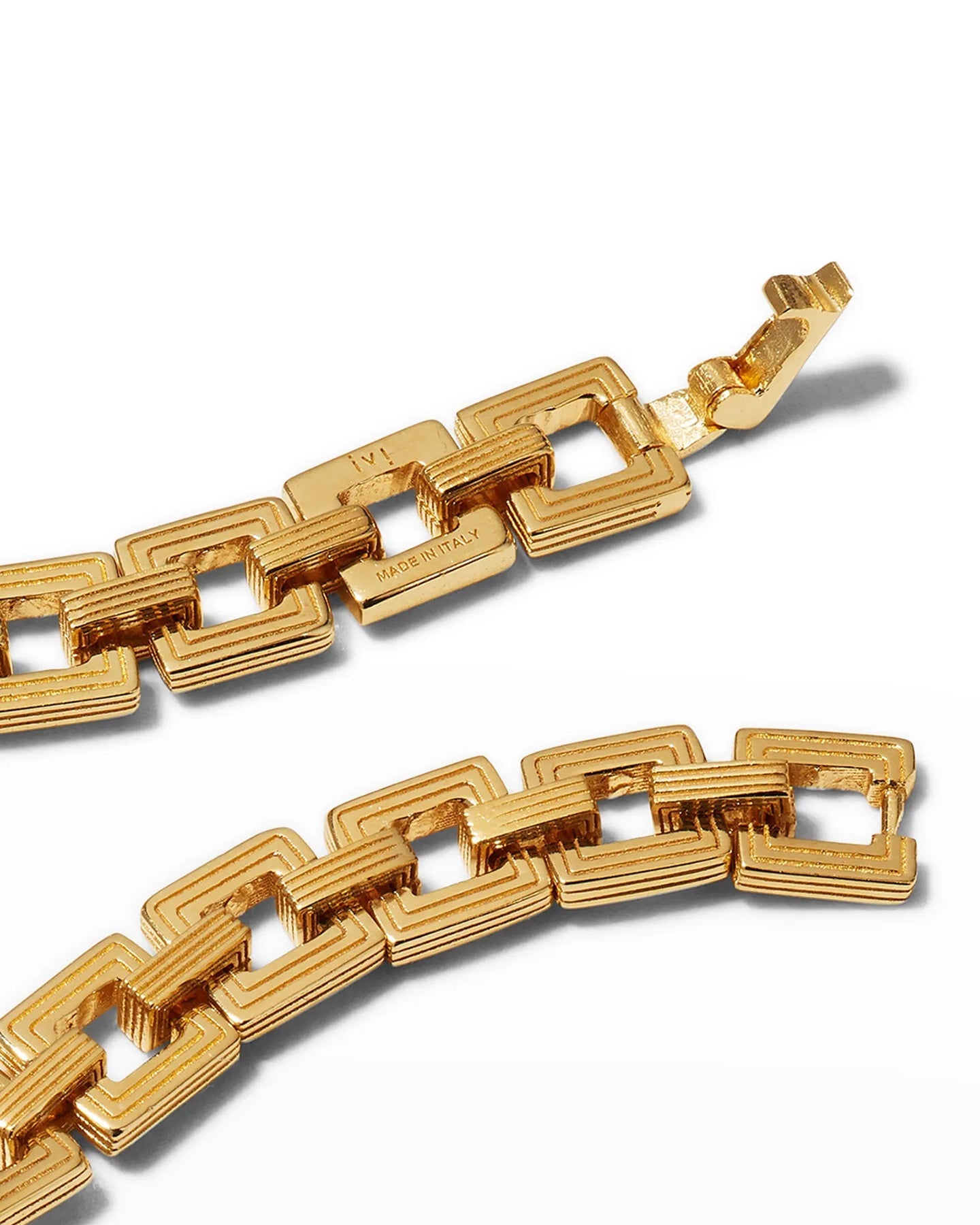 A close up of a gold-plated Aurelia Chain bracelet with interlocking square links displayed on a white background.
